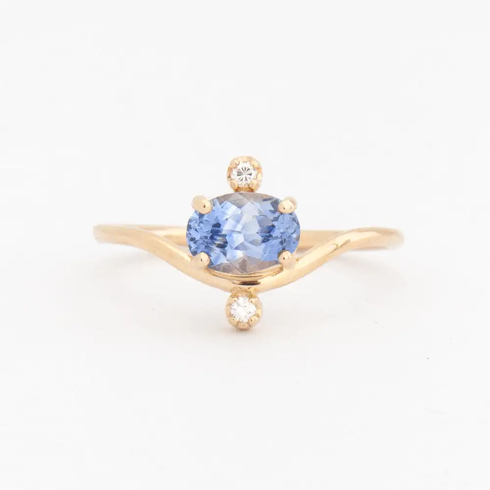 0.94 ct Oval Sapphire and Diamond Nestled Ring